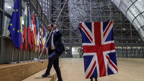 A man taking down the Union Jack from the rest of the flags within the European Union, symbolising the United Kingdoms departure (Brexit). Hinting that there are changes, such as Tax Free benefits..